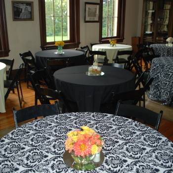 Tables and chairs set up inside